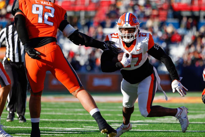 Feb 5, 2022; Mobile, AL, USA; American squad running back Dameon Pierce of Florida (27) runs with the ball in the second half against the National squad at Hancock Whitney Stadium.